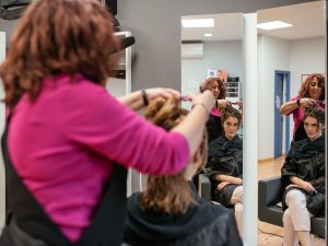 Hairdresser drying woman's hair